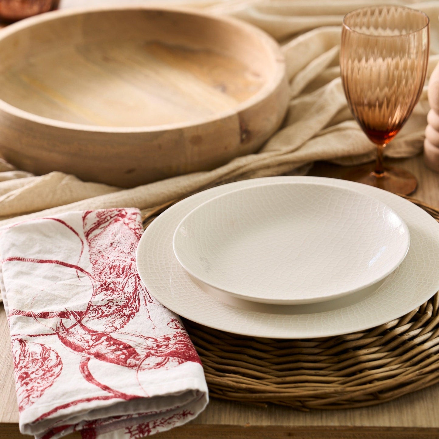 a table topped with plates and glasses of wine