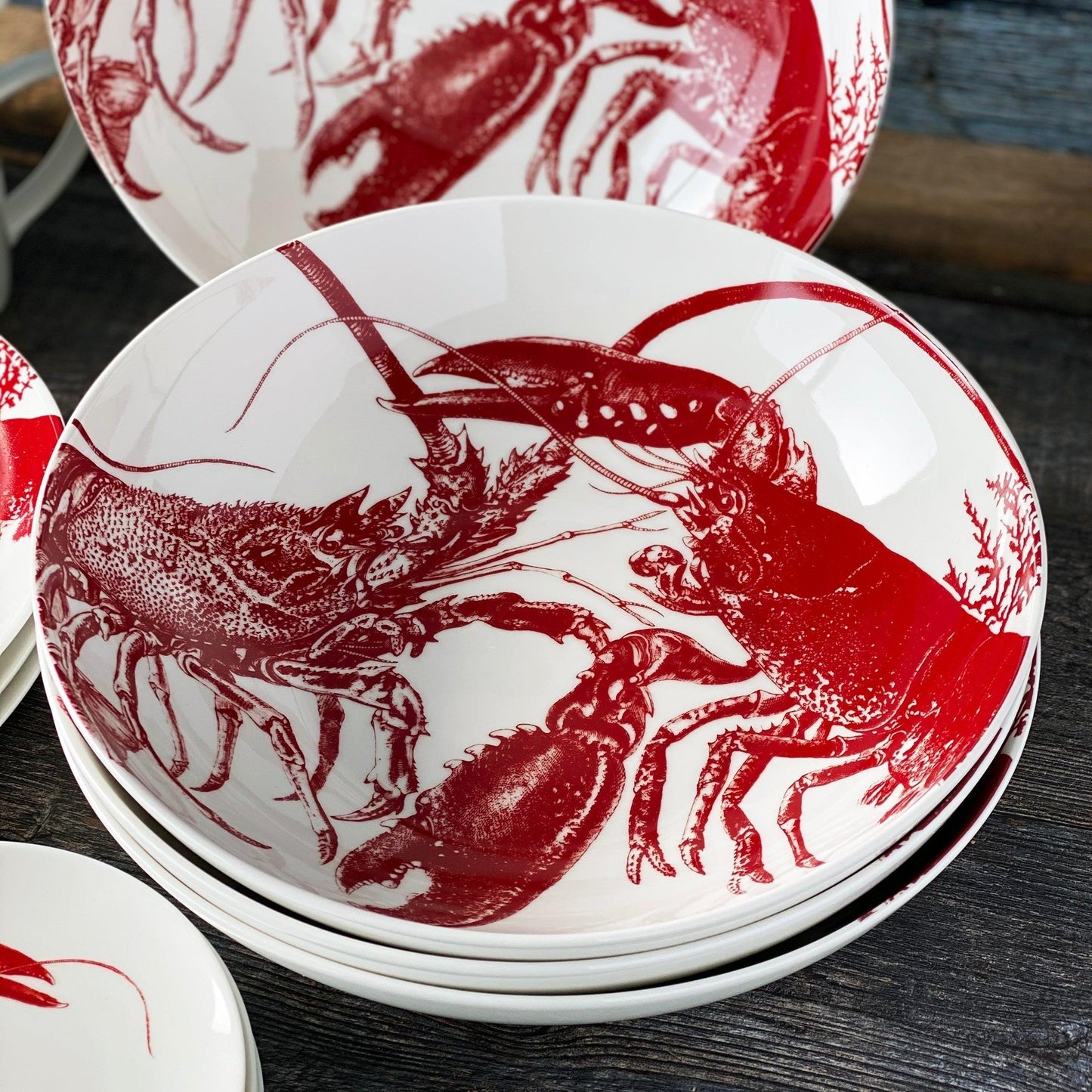 a close up of a plate with a lobster on it