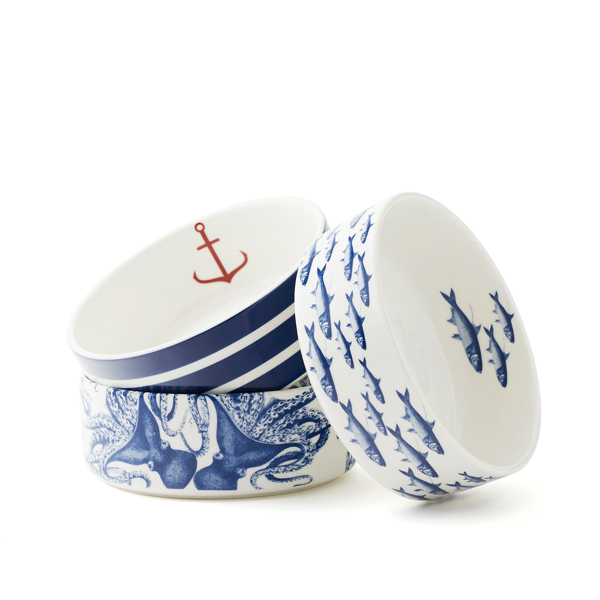 Lucy blue octopus pet bowl beneath a striped anchor bowl beside a tilted School of Fish bowl