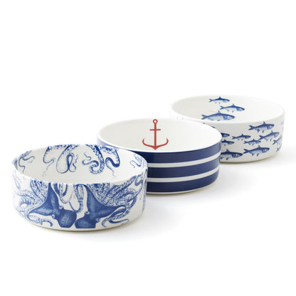 Blue and white pet bowls arranged in a row with octopus, striped anchor, and School of Fish patterns
