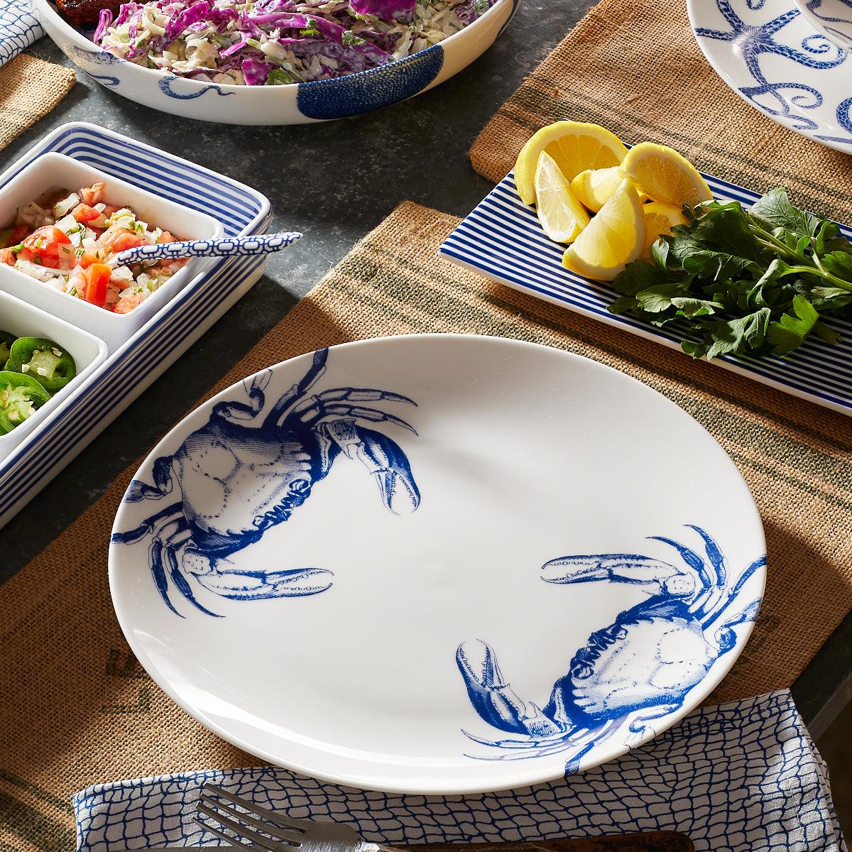 a table topped with plates of food and bowls of salad