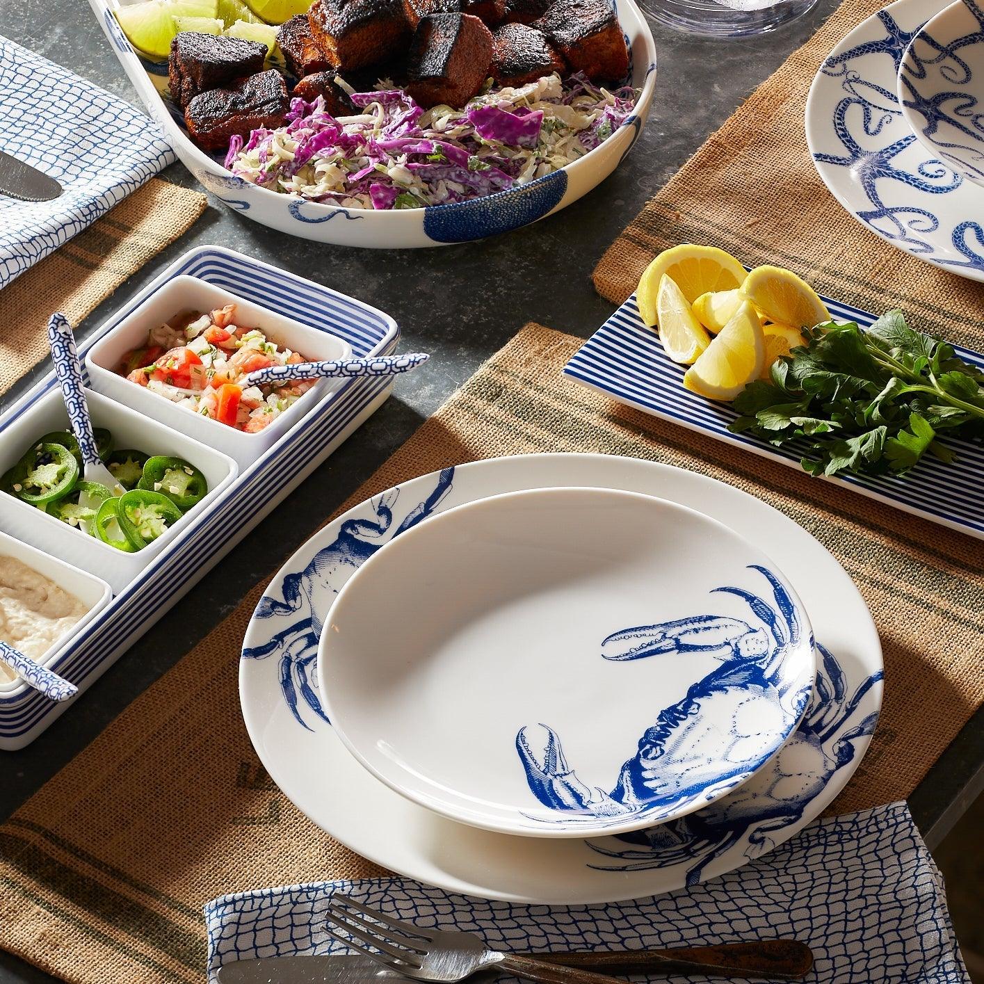 a table topped with plates and bowls filled with food