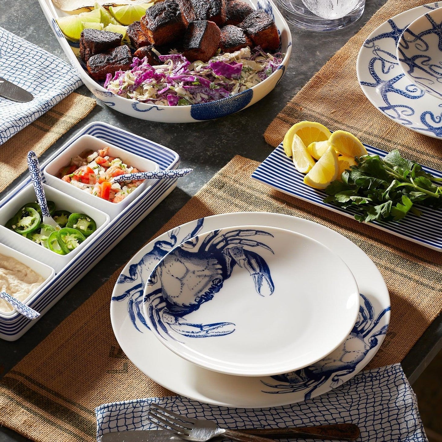 a table topped with plates and bowls filled with food