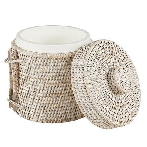 a white wicker basket with a lid