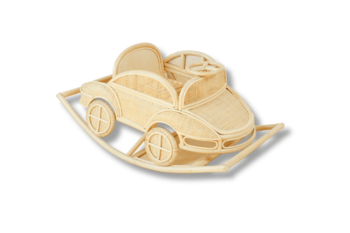Natural rattan rocking car with decorative wheels, steering wheel, cushions, and curved rocking runners