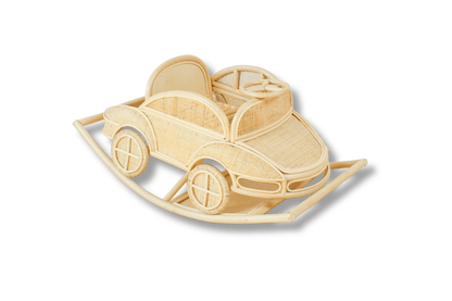 Natural rattan rocking car with decorative wheels, steering wheel, cushions, and curved rocking runners
