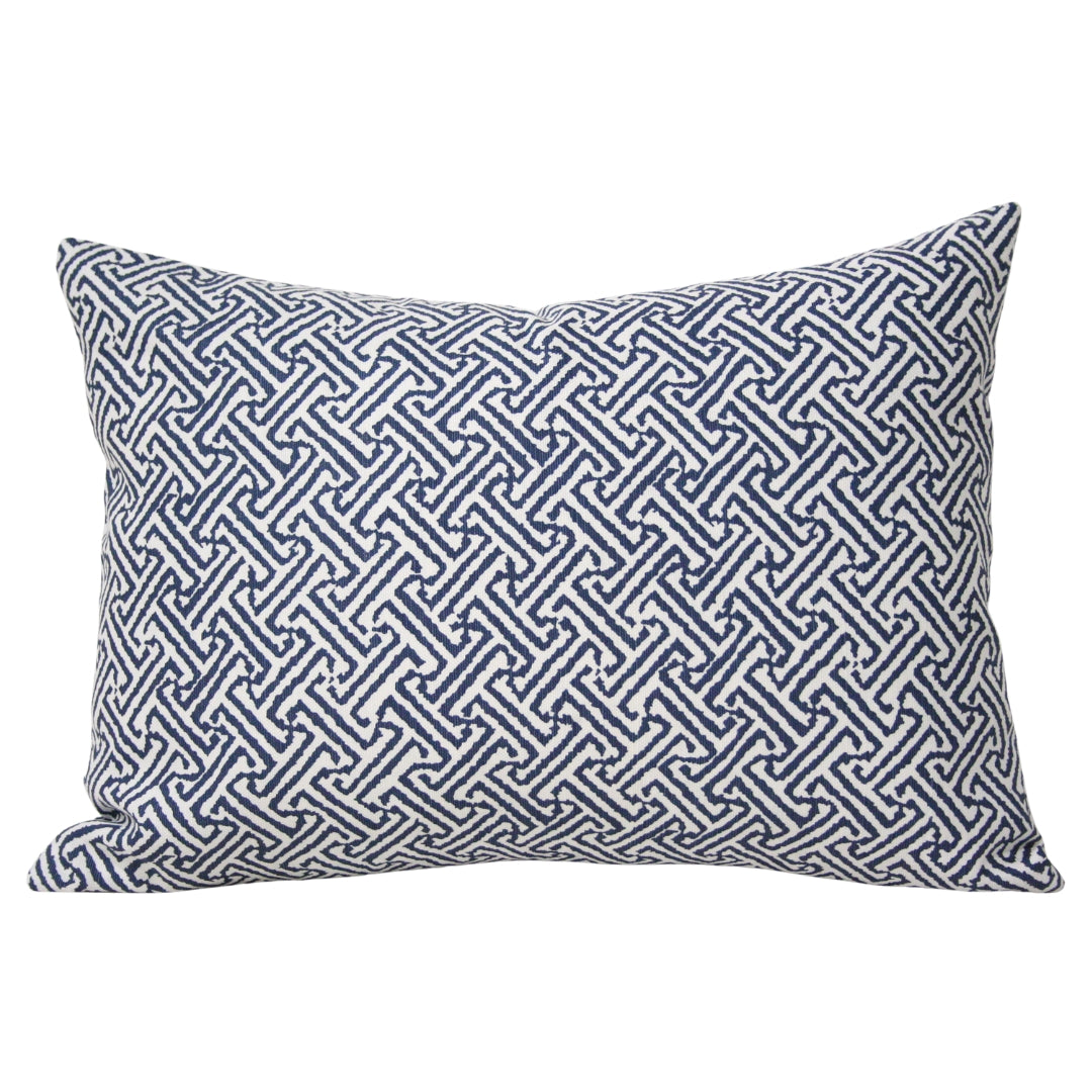 	Java Java Navy rectangular lumbar pillow cover styled with an insert, showing its repeating angular geometric pattern