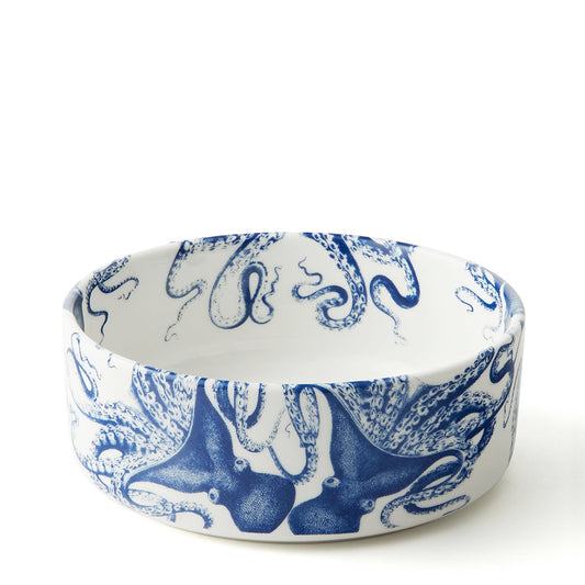 Lucy medium porcelain pet bowl with a blue octopus wrapping around the white exterior and tentacles inside