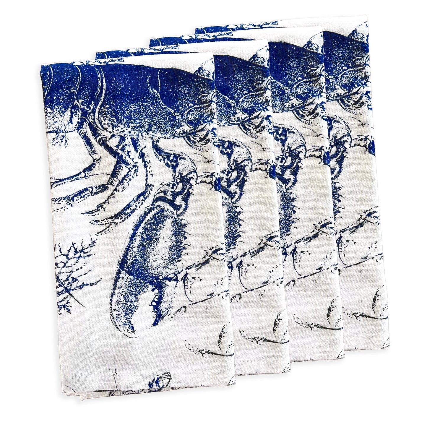 a set of four blue and white napkins on a white background