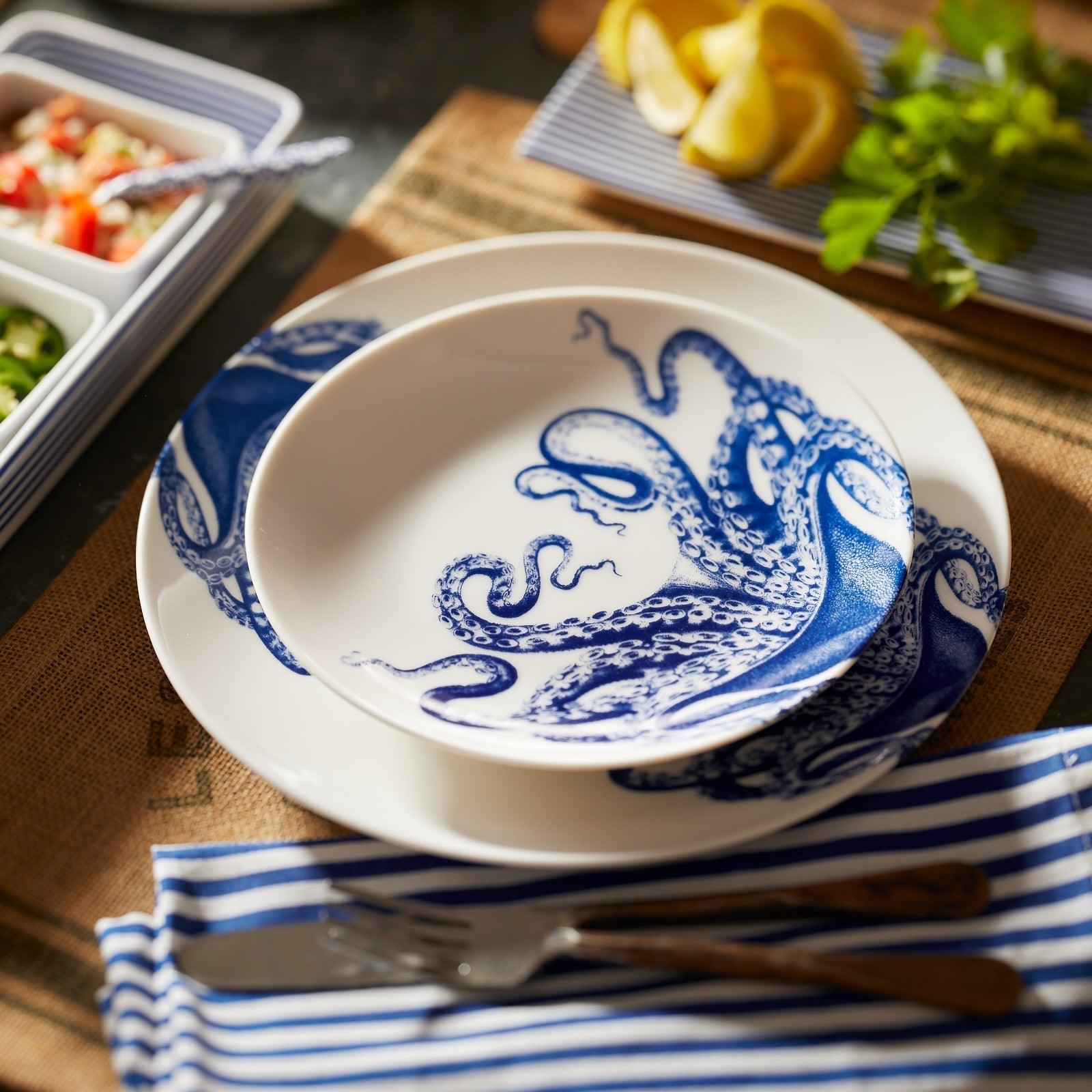 a blue and white plate with an octopus on it