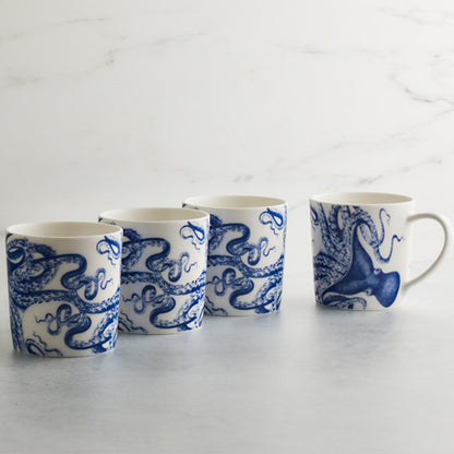 Four Lucy blue octopus porcelain mugs arranged to show the wraparound design