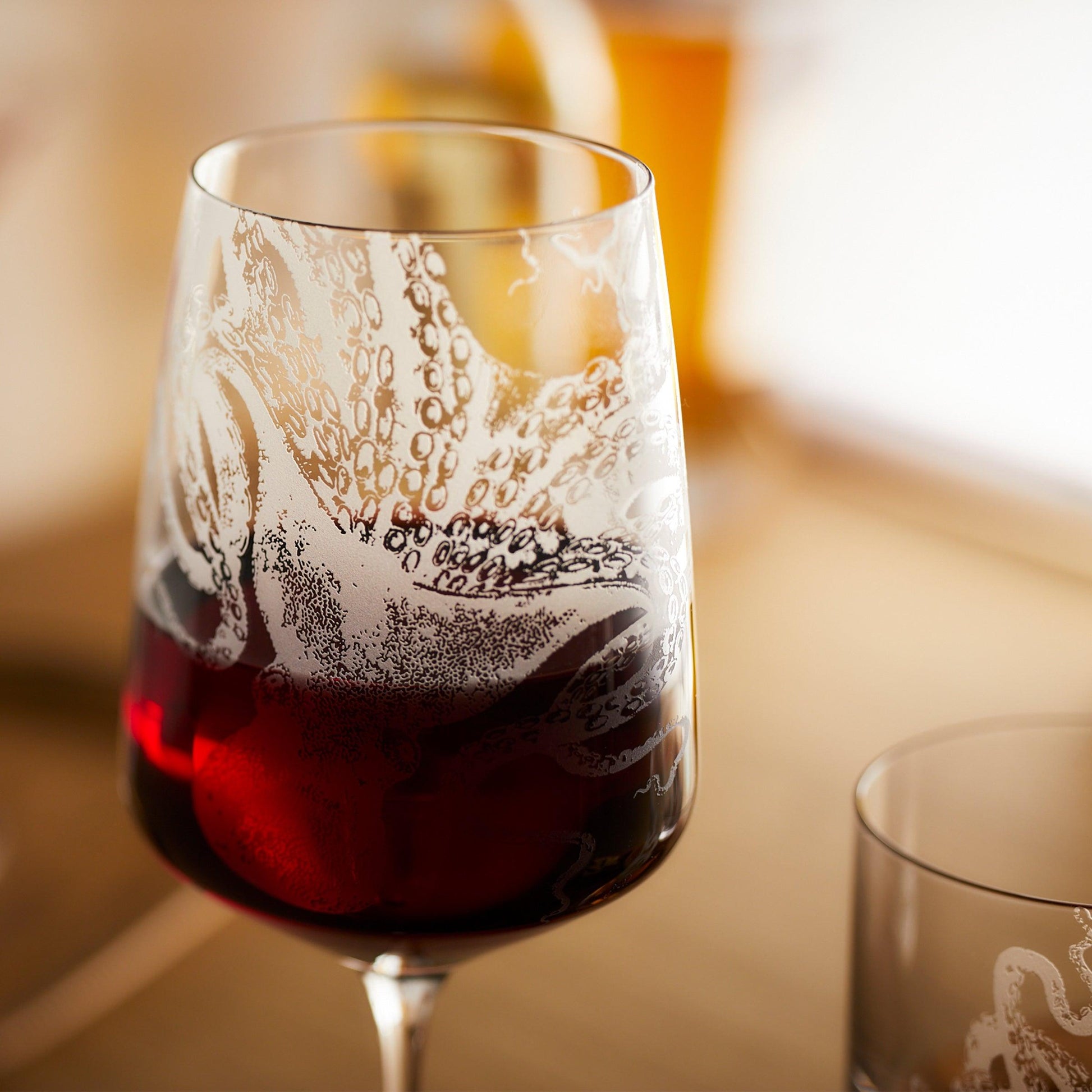 a close up of a wine glass on a table