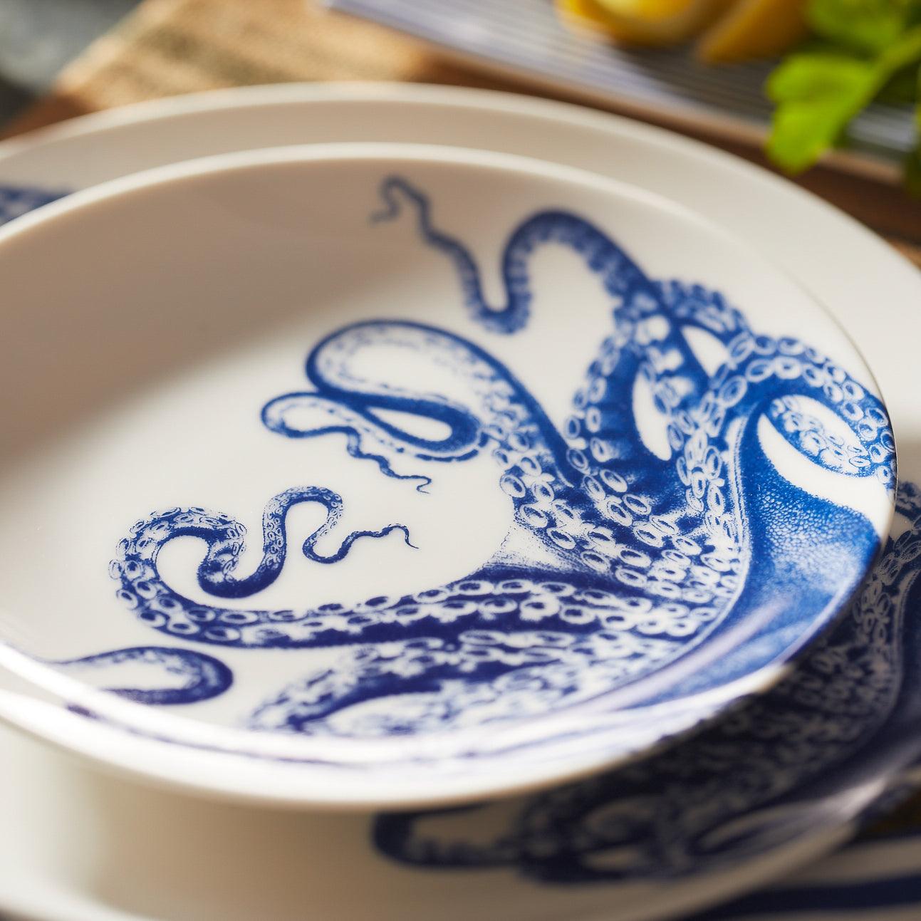 a close up of a plate with an octopus on it