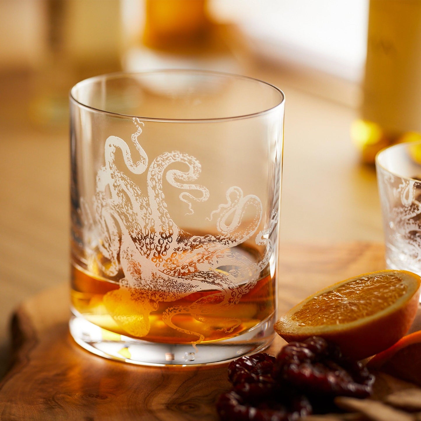 a close up of a glass of alcohol on a table