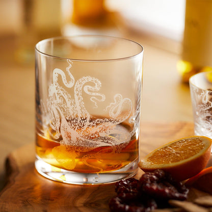 a close up of a glass of alcohol on a table