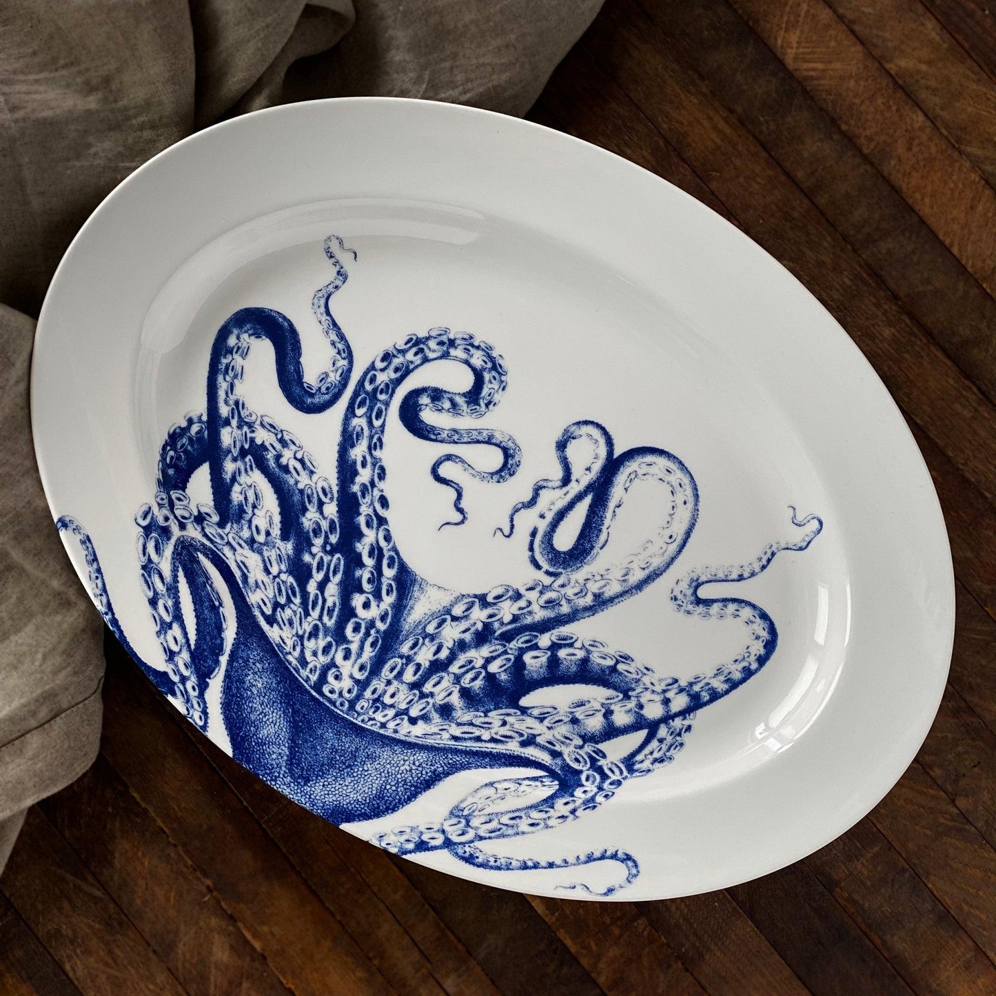 a blue and white plate with an octopus on it