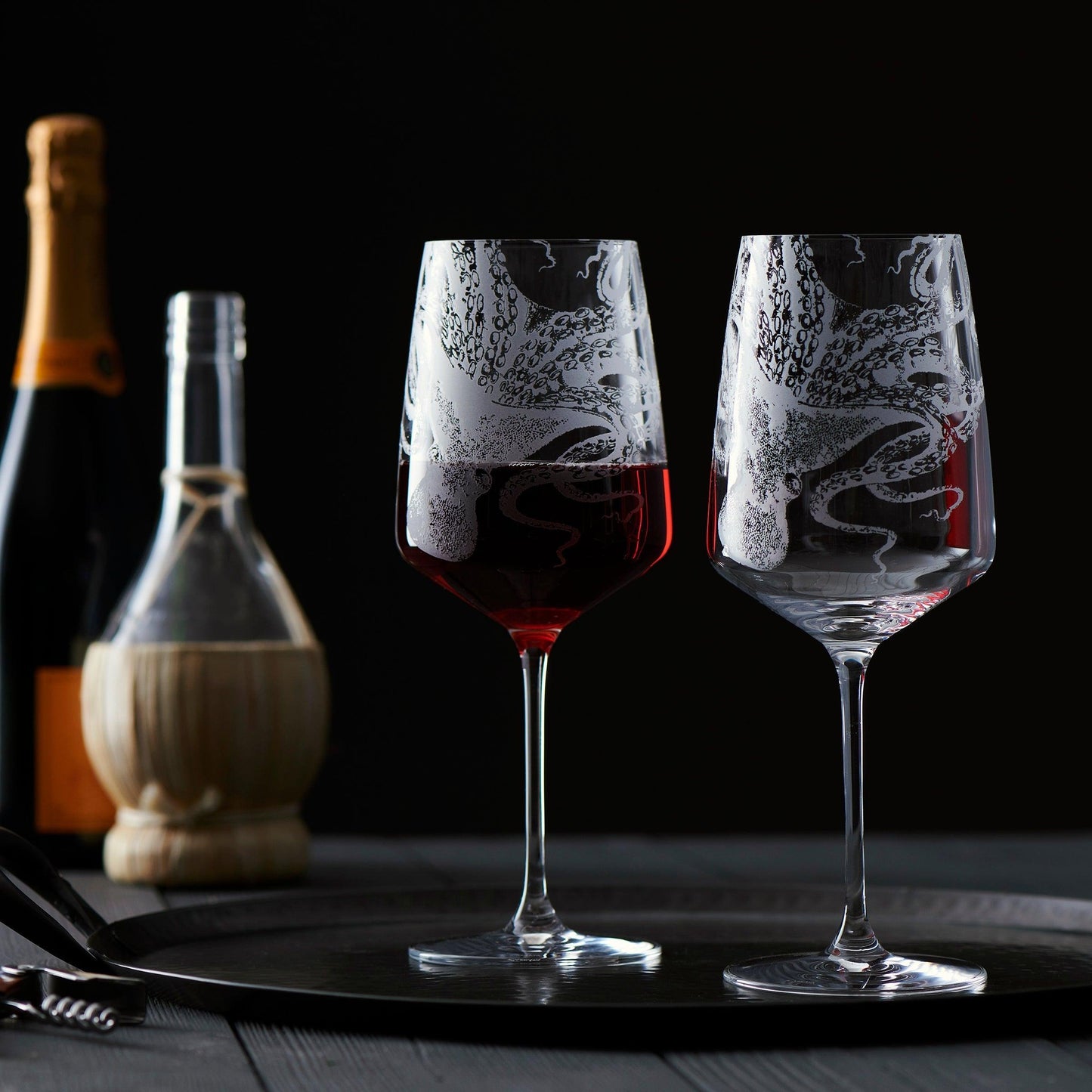 a couple of wine glasses sitting on top of a table