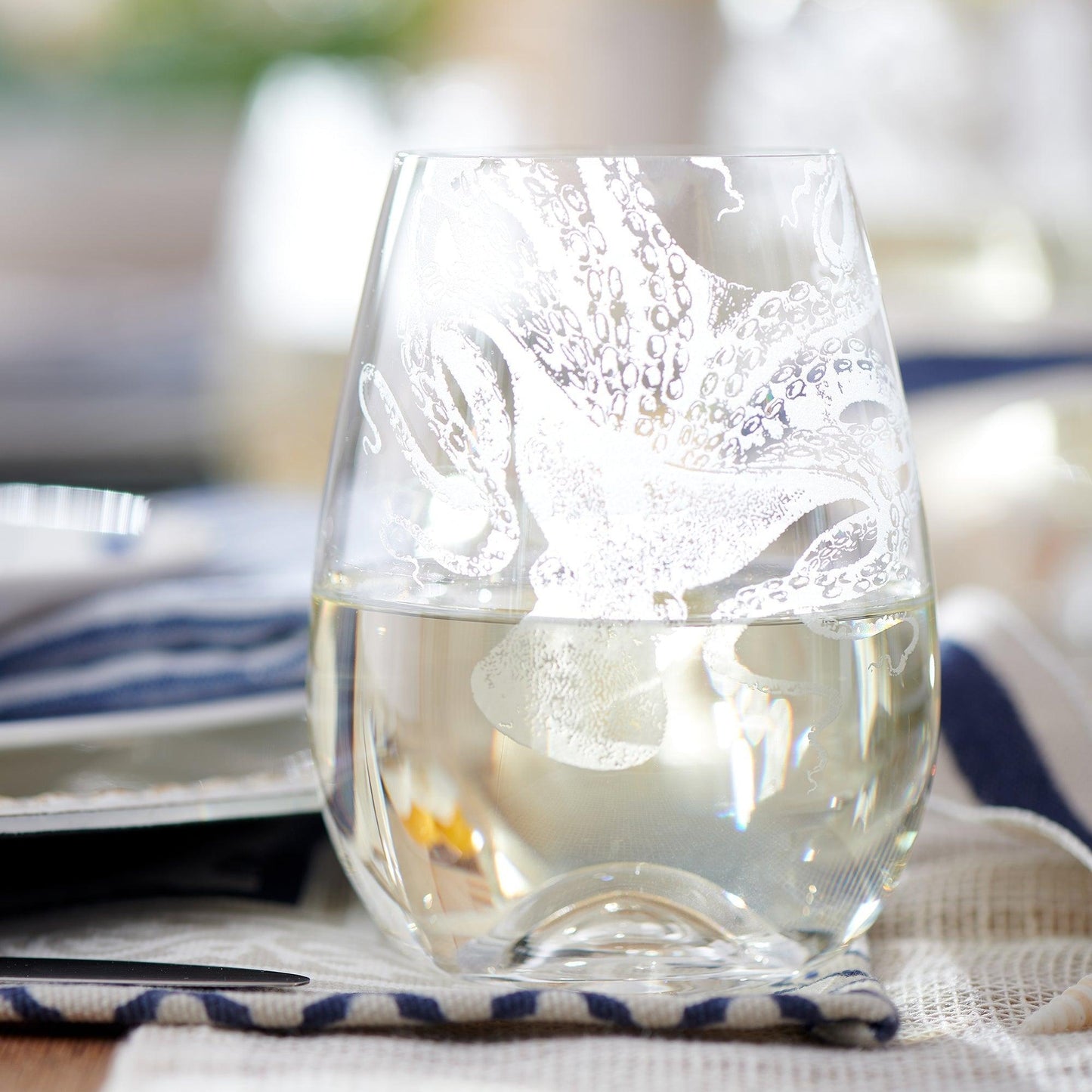 a glass of water sitting on top of a table