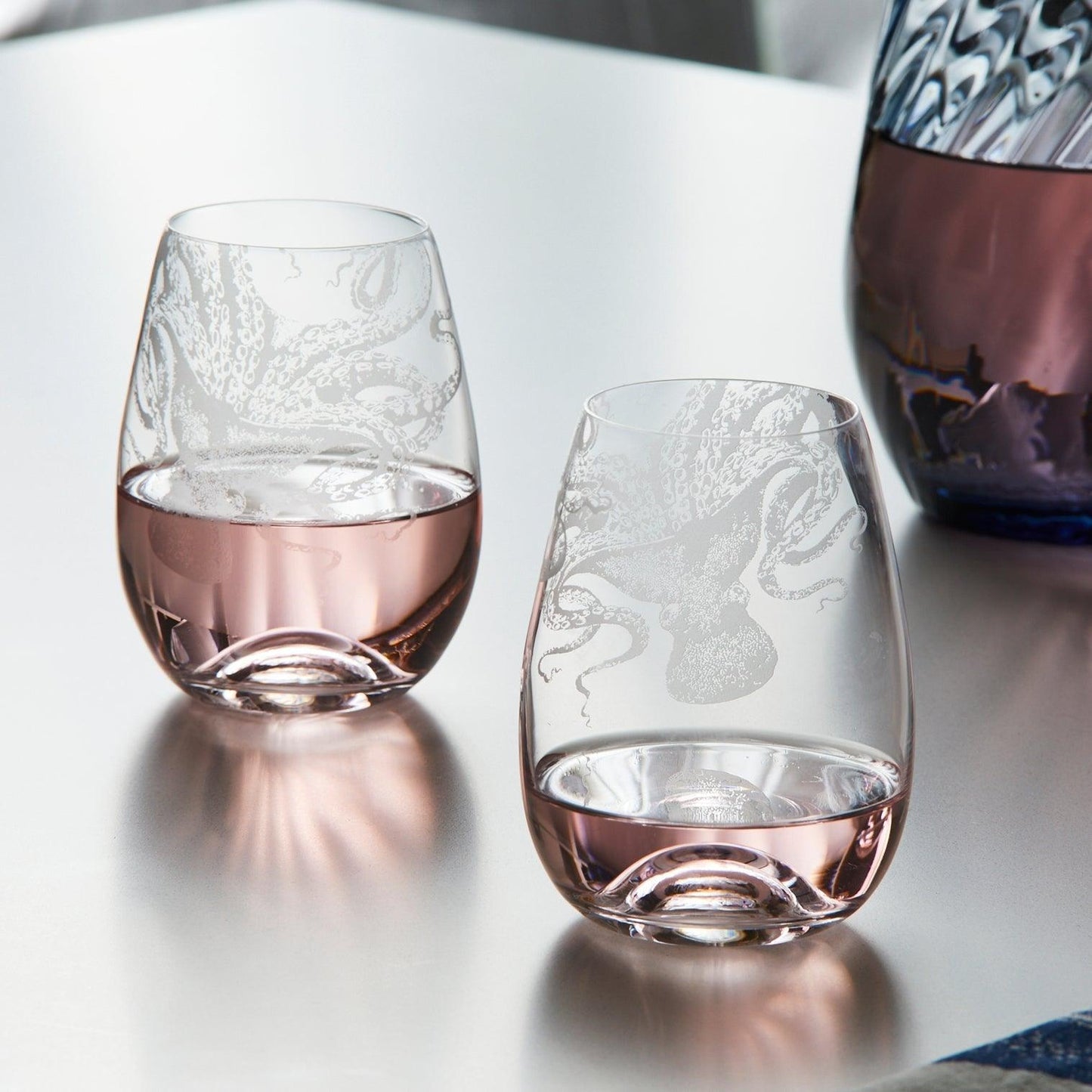 a couple of wine glasses sitting on top of a table