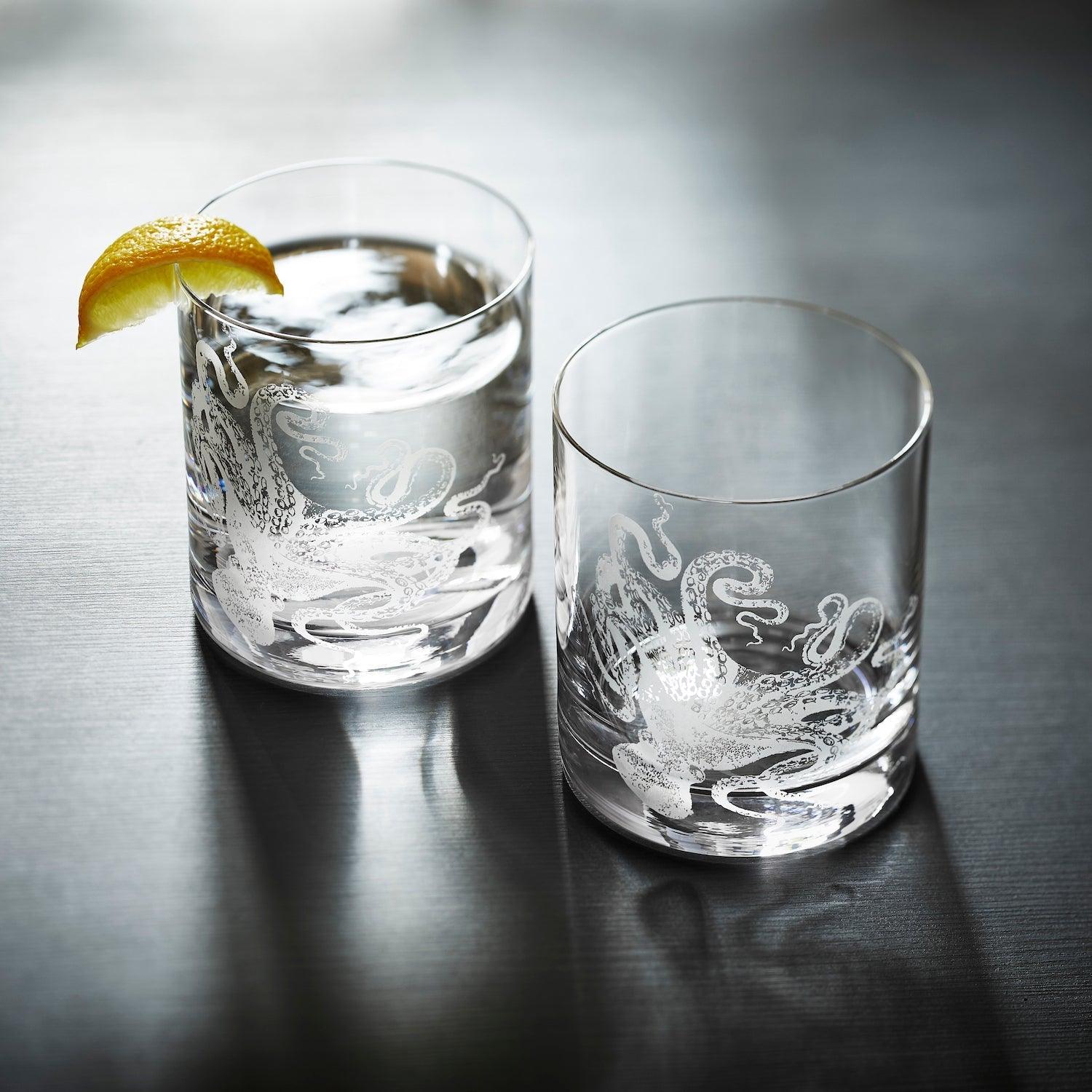 a couple of glasses sitting on top of a table