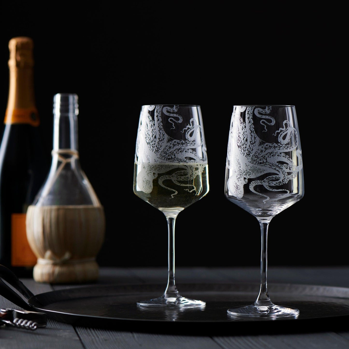 a couple of wine glasses sitting on top of a table