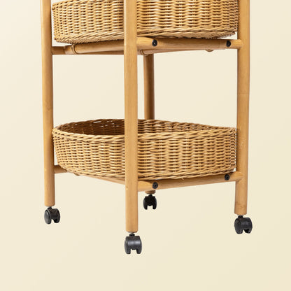 	Detail of the trolley’s lower basket trays, rattan legs, and black wheels
