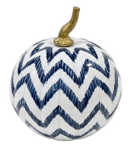 White decorative pumpkin with hand-painted navy chevron stripes and a curved gold-colored stem