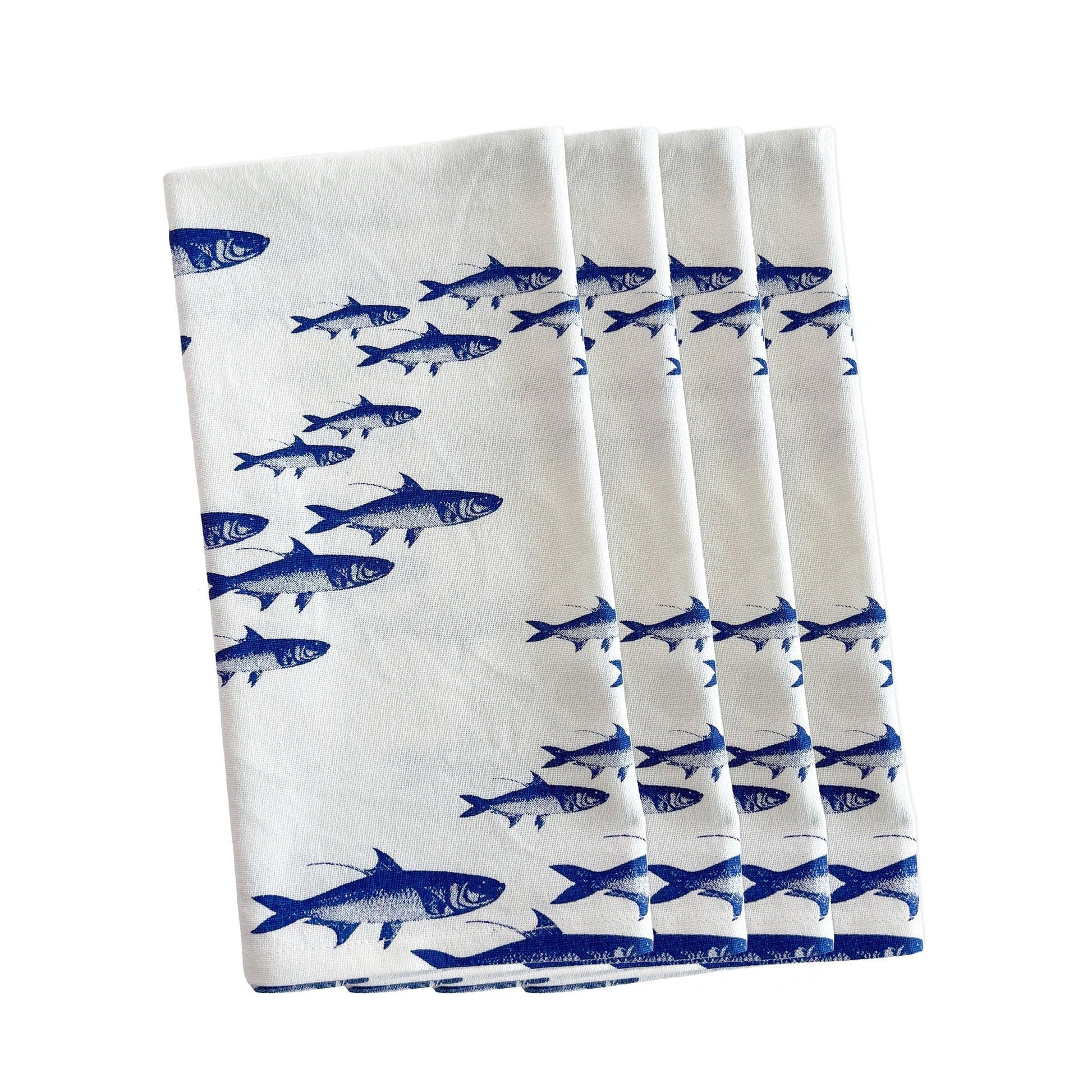 a set of six blue and white napkins with fish on them