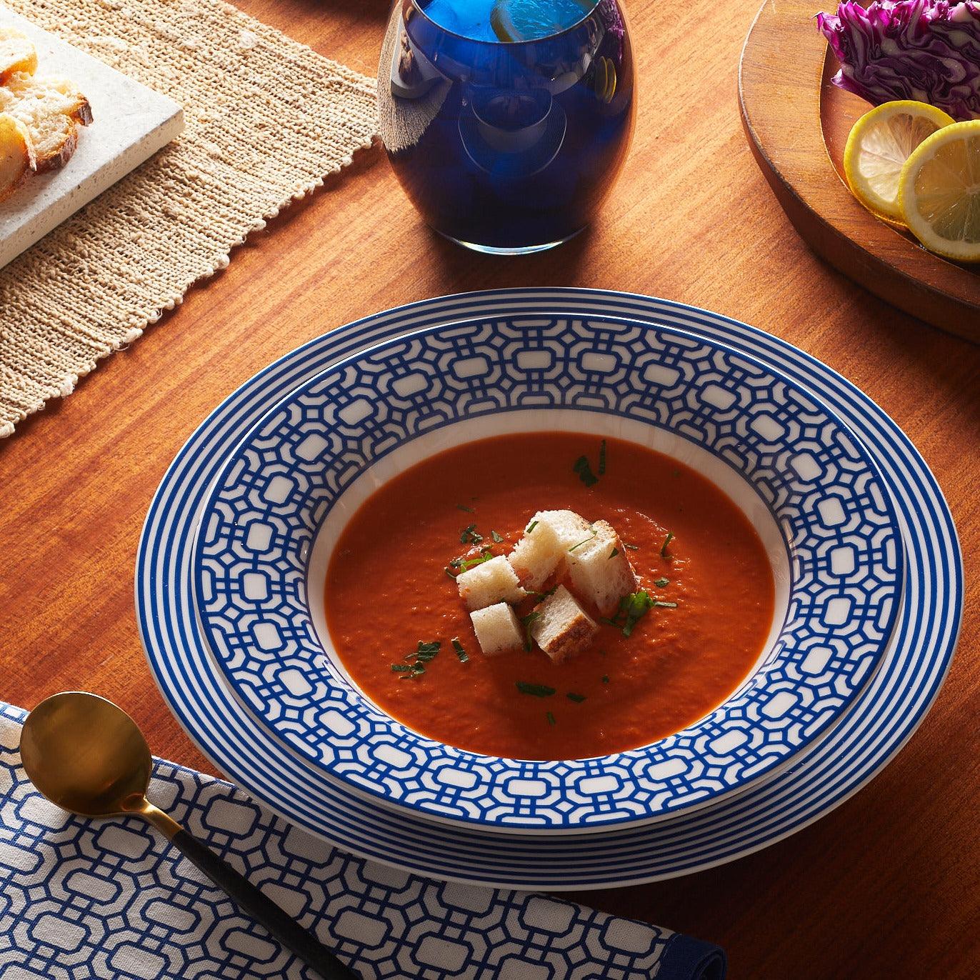 a bowl of soup on a wooden table