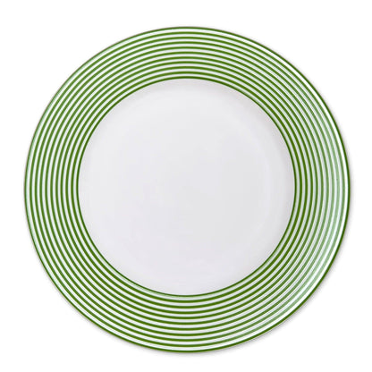 a green and white plate on a white background