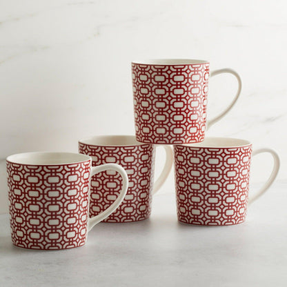 a set of four red and white coffee mugs