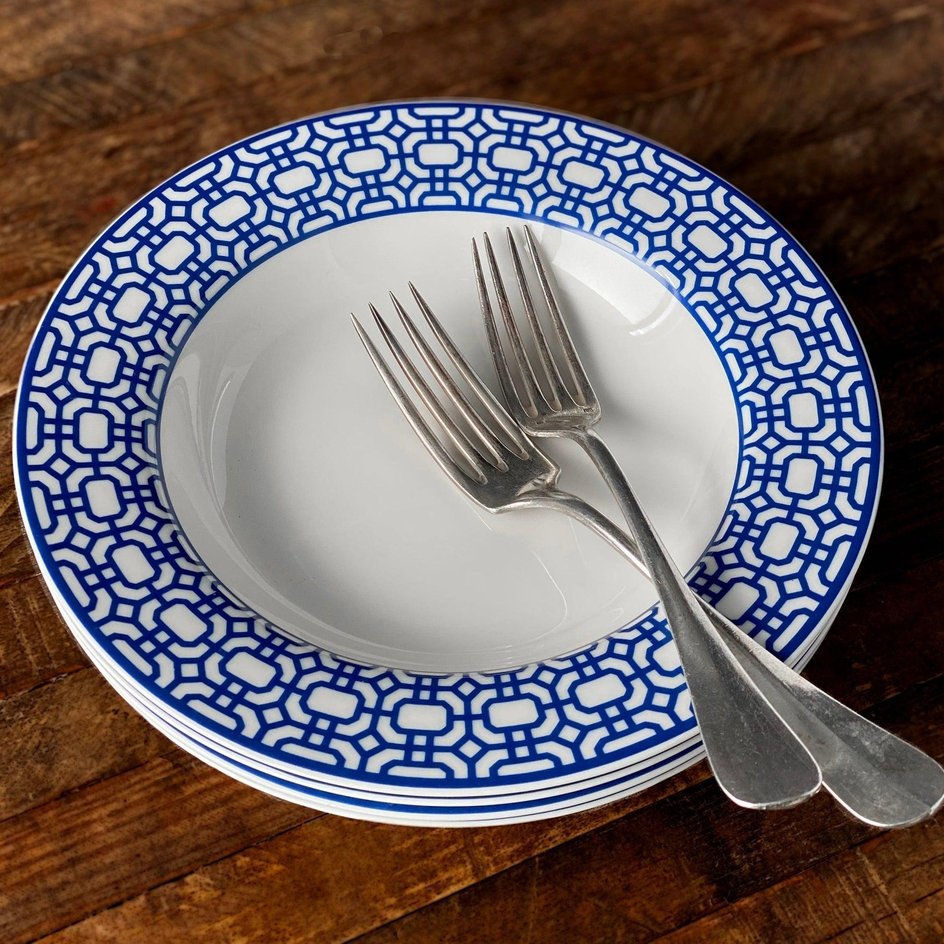 a blue and white plate with a fork on it