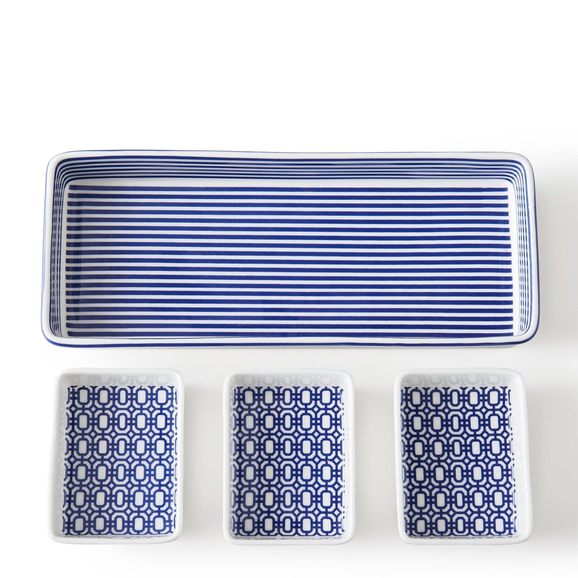 a set of four blue and white playing cards