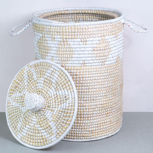 a white and beige basket with a fan on top of it