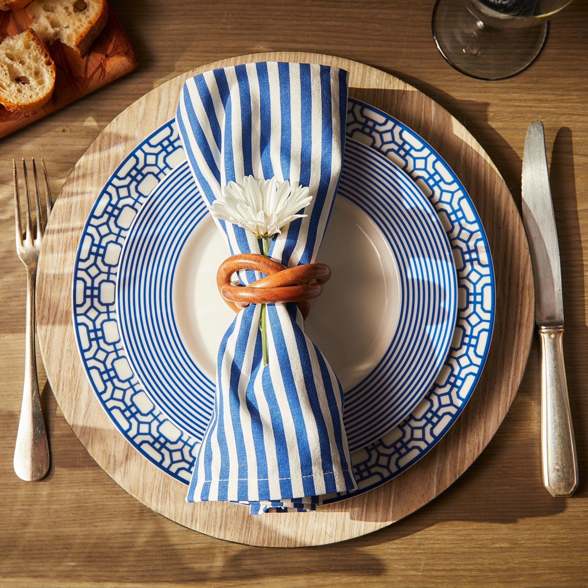 a blue and white plate with a flower on it