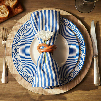 a blue and white plate with a flower on it