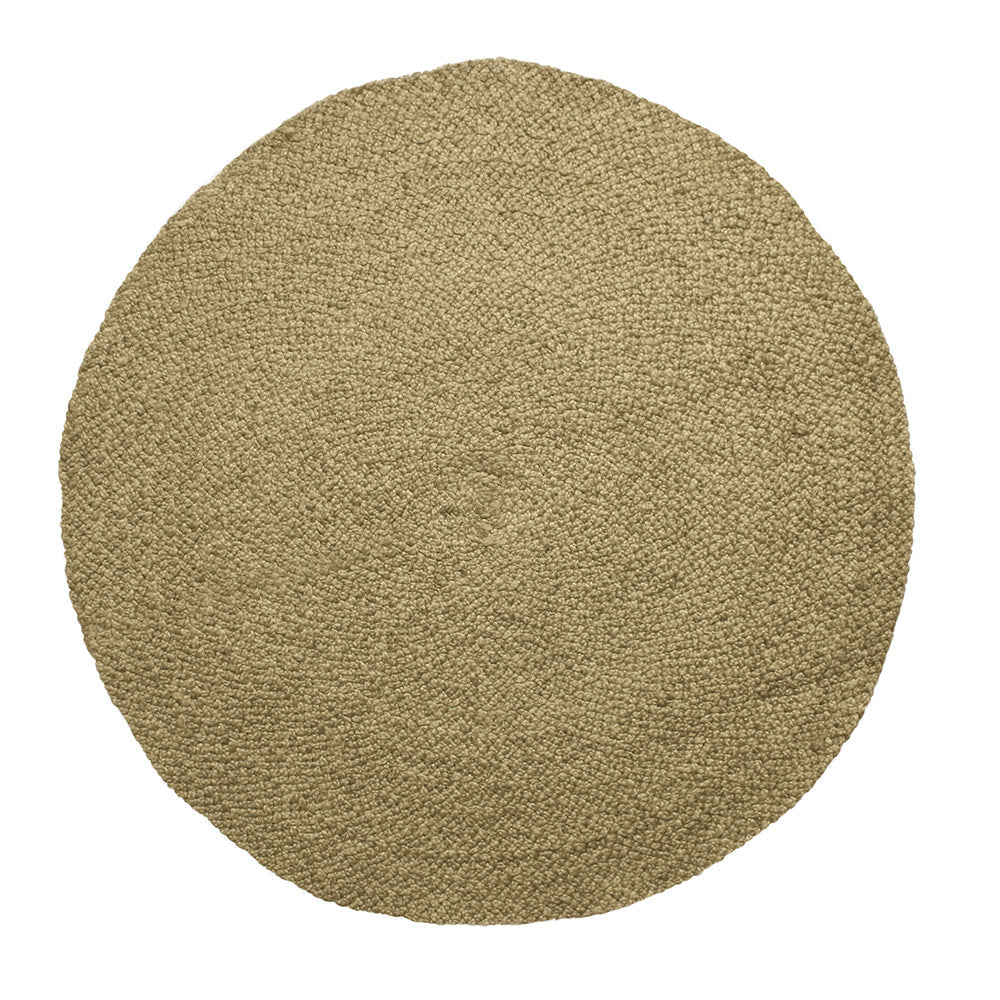 Overhead view of the natural round braided jute rug on a white background