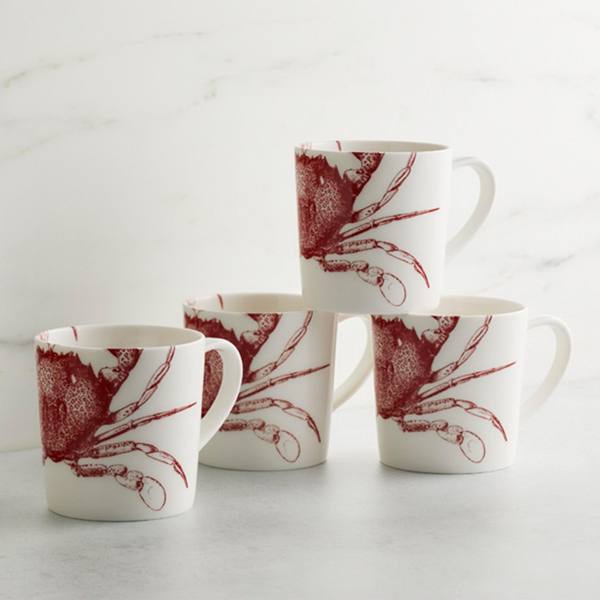 a group of four coffee cups sitting on top of a table