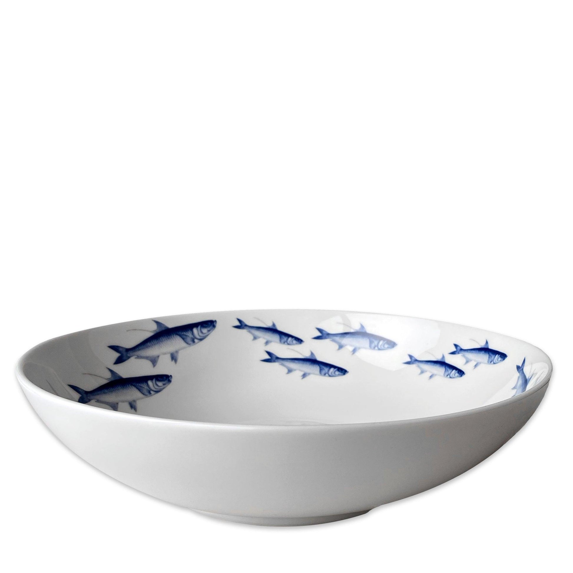 a white bowl with blue fish on it