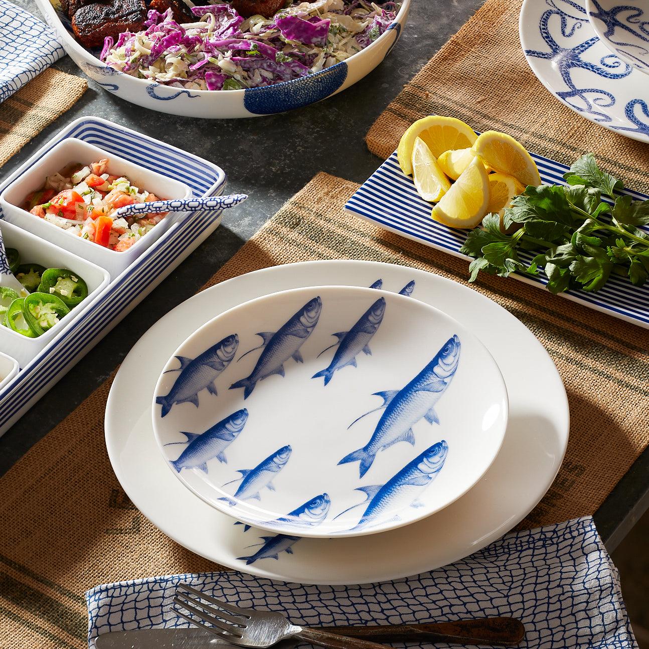 a table topped with plates and bowls filled with food