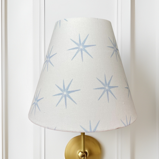 Blue star clip-on sconce shade with beige background