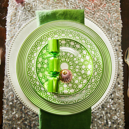 a green and white plate on a table
