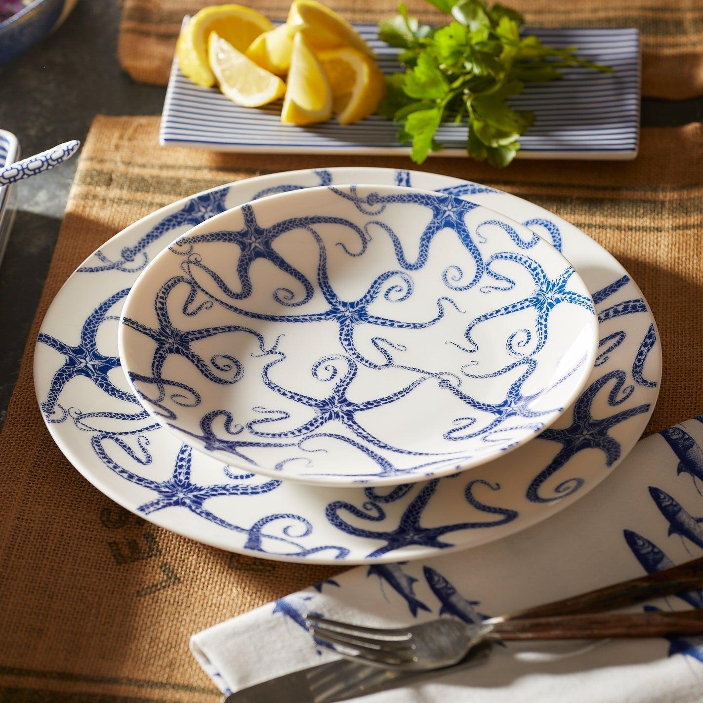 a blue and white plate sitting on top of a table