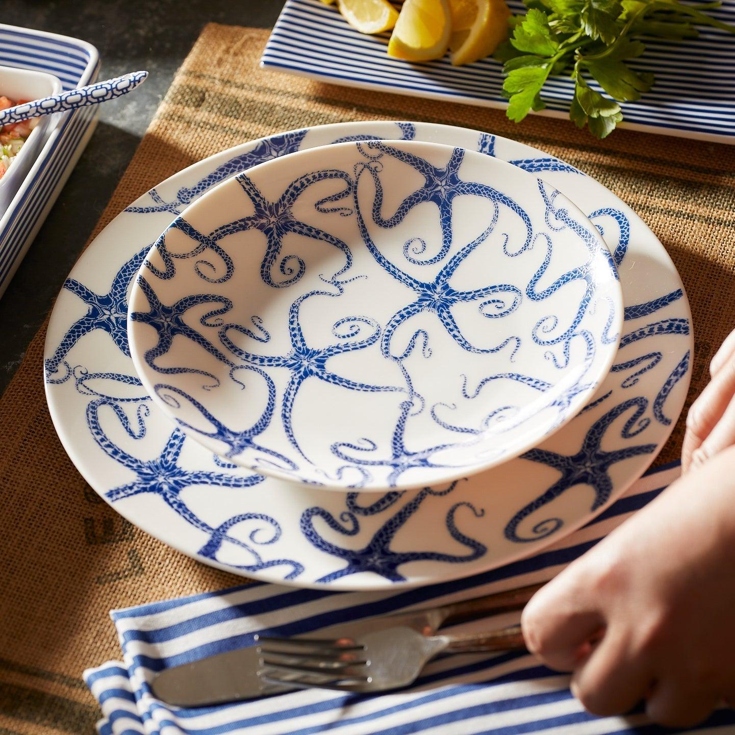 a blue and white plate sitting on top of a table