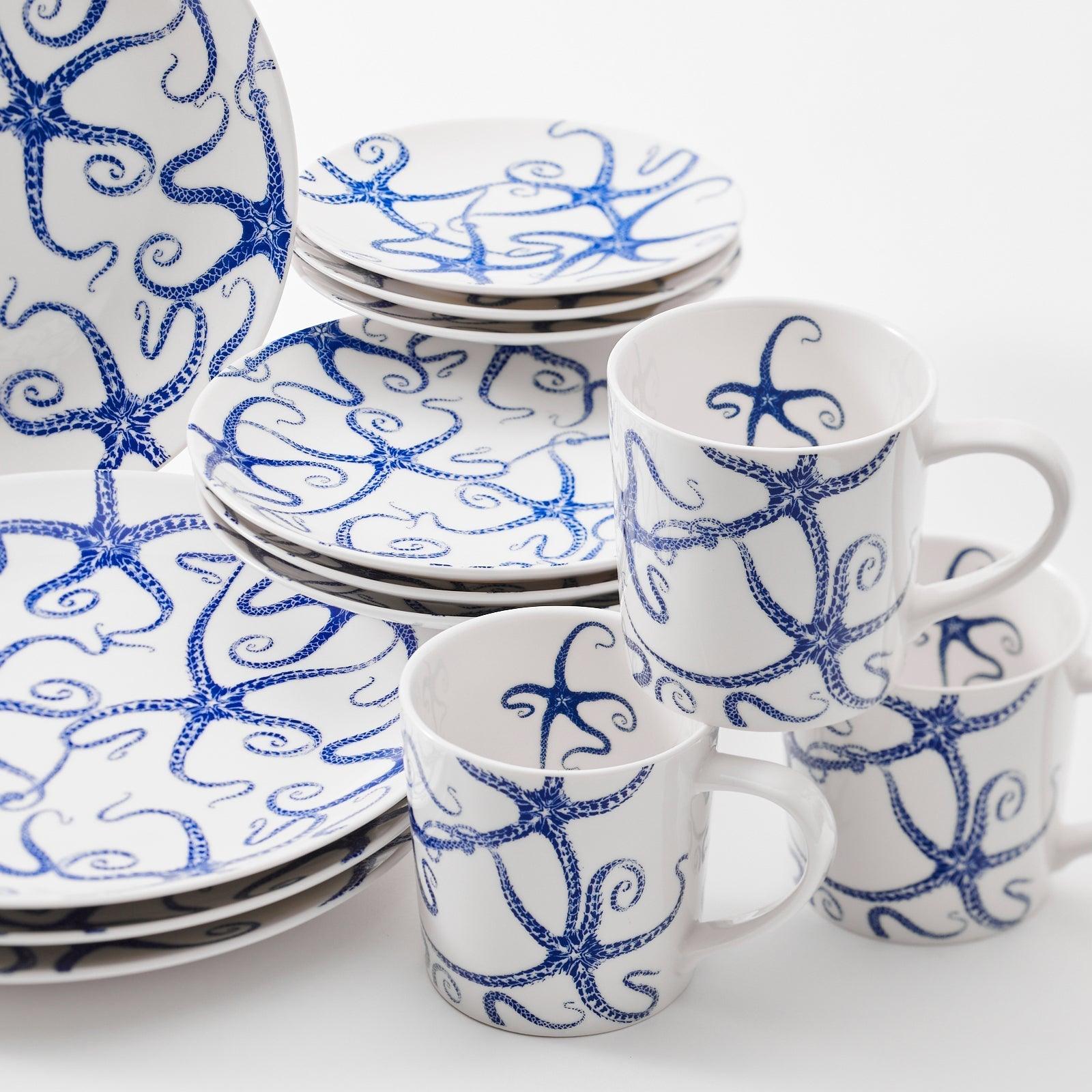 a group of blue and white cups and saucers