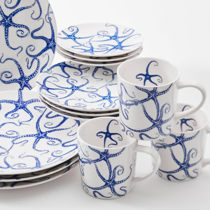 a group of blue and white cups and saucers