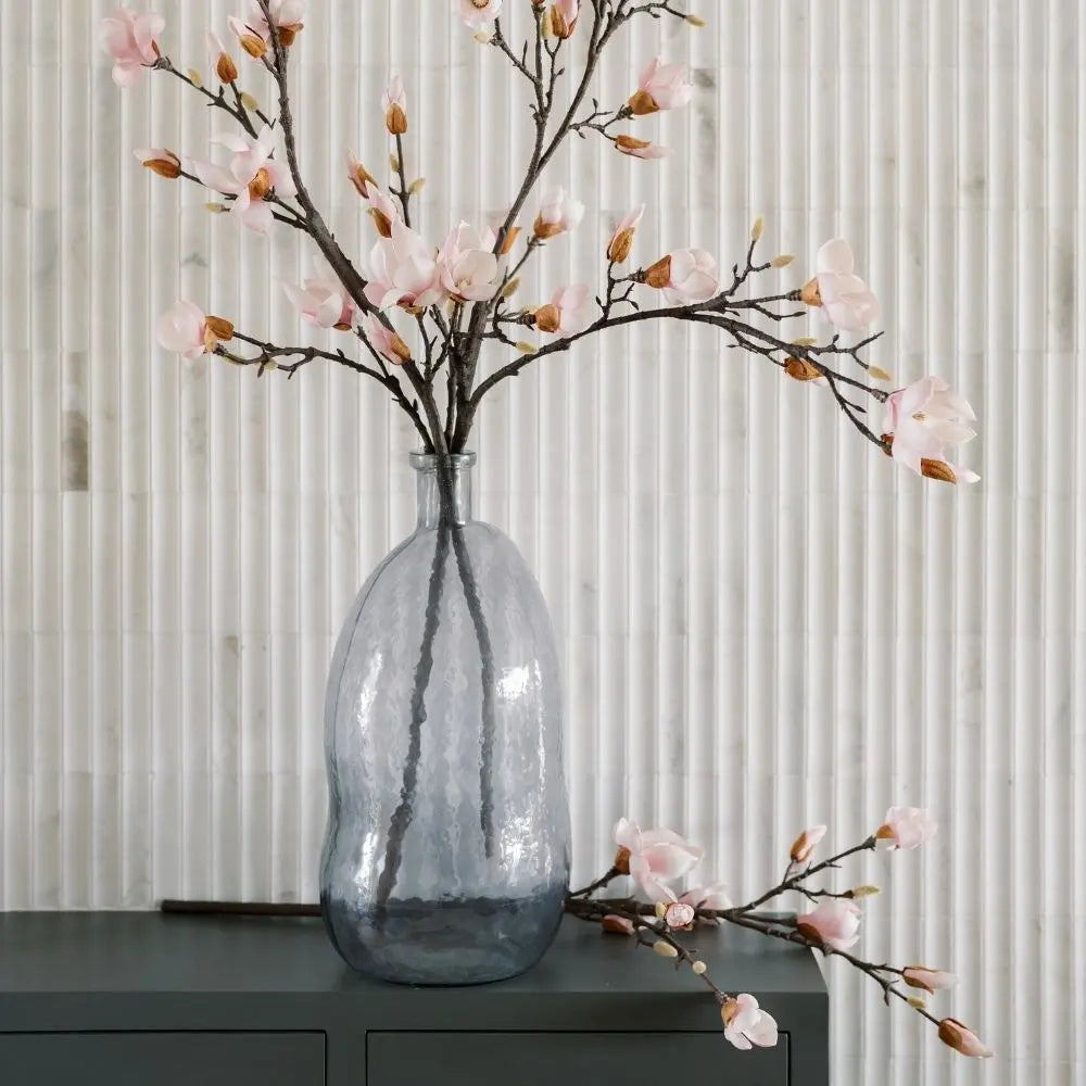 Smoke gray glass vase displayed on console table
