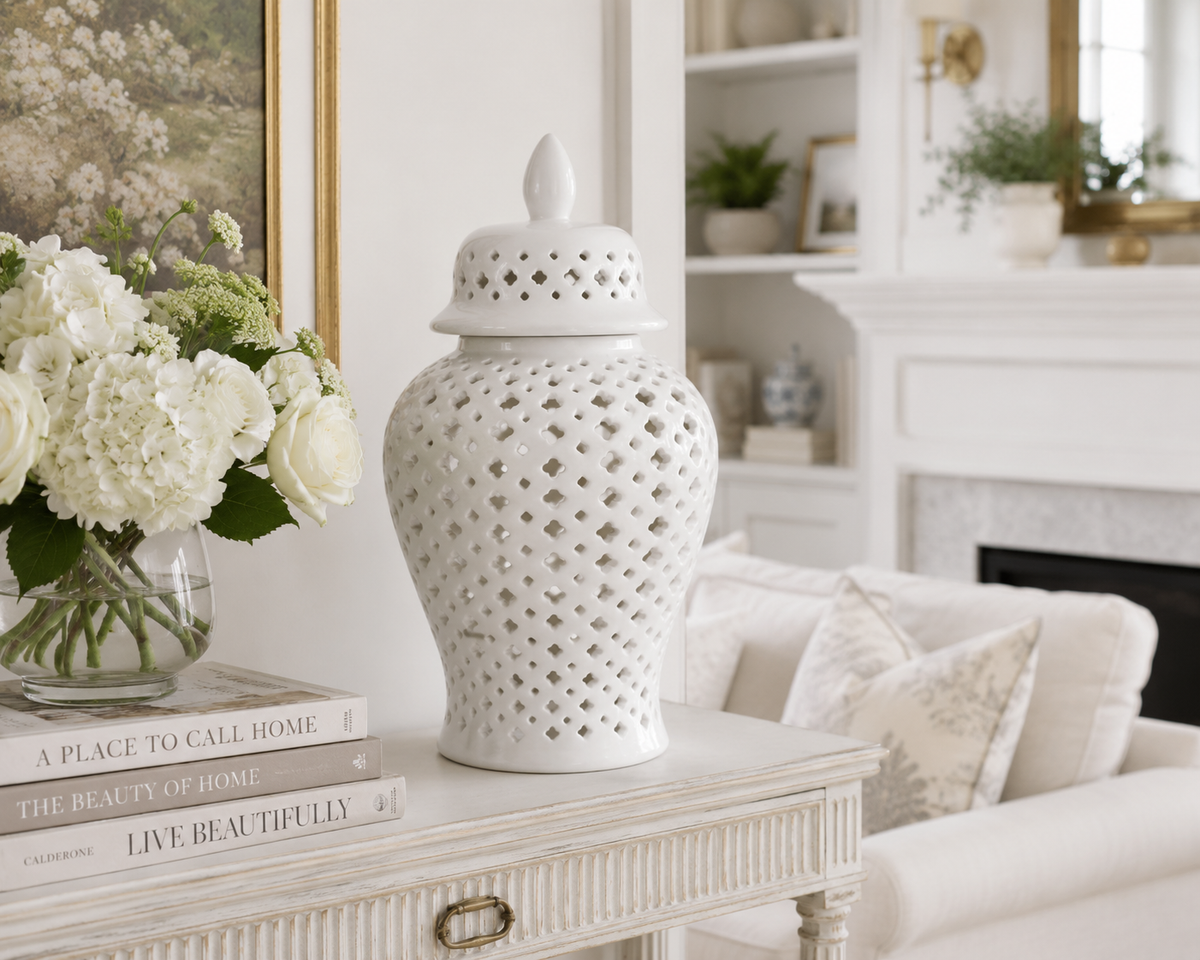 White pierced porcelain jars displayed as home decor