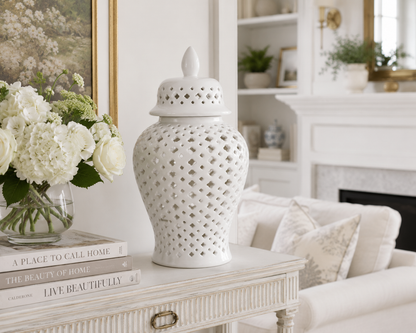 White pierced porcelain jars displayed as home decor