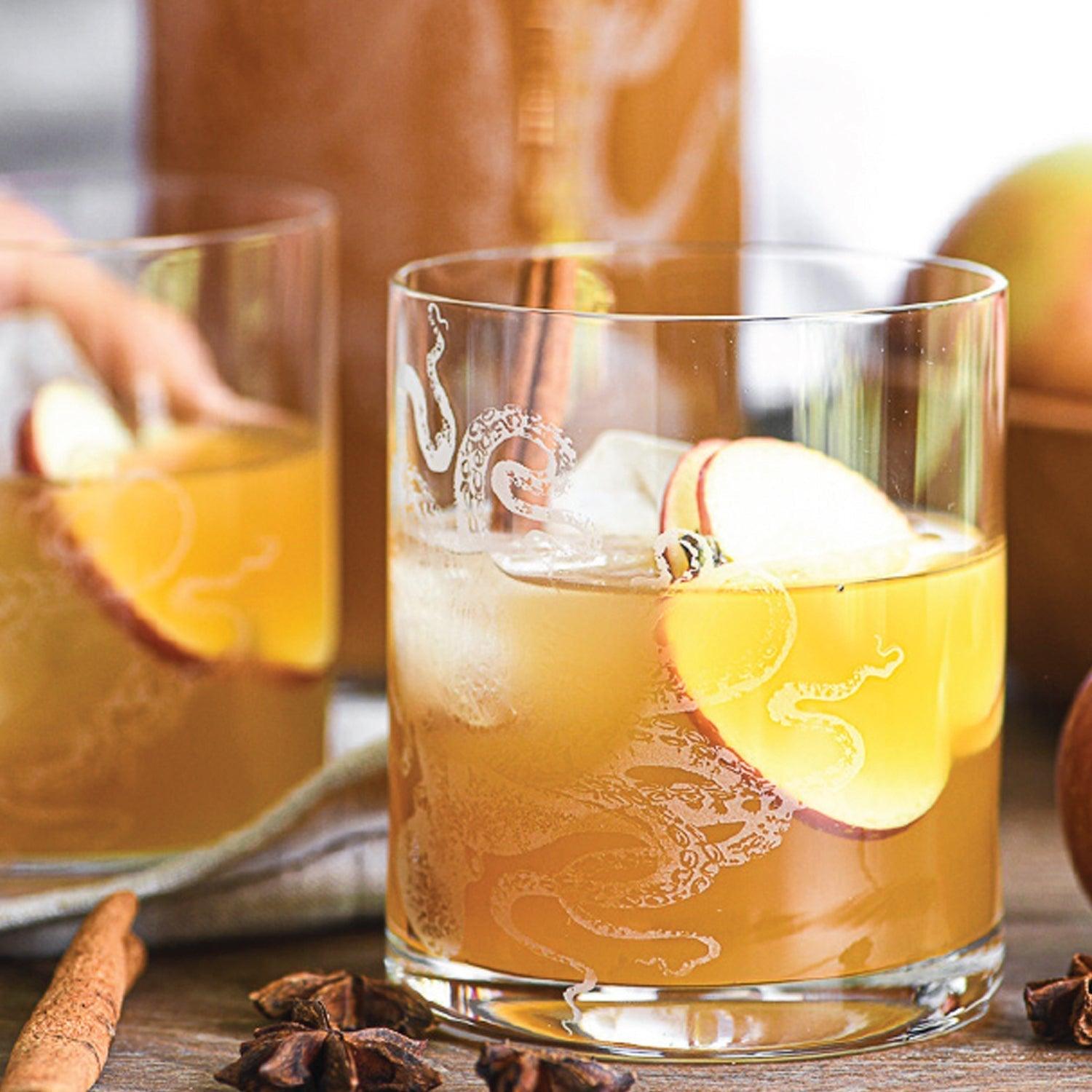 a glass of apple cider on a table